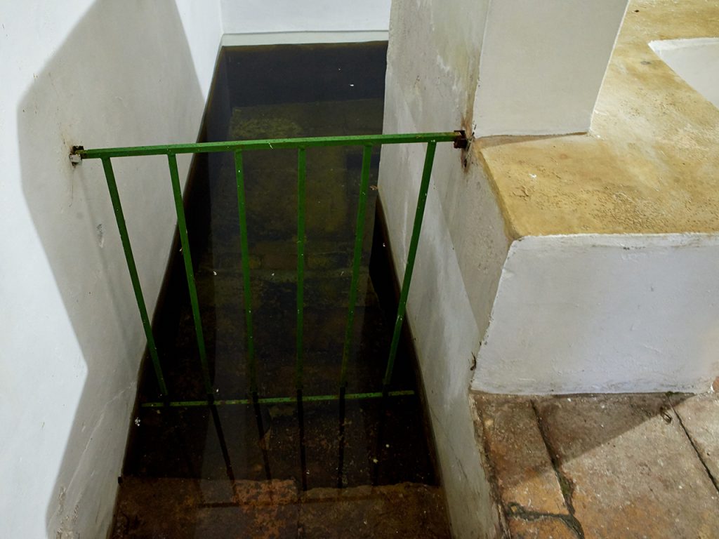 Mikveh, stairs into water pool.